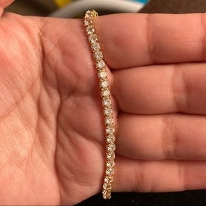 Bracelet in gold tone, mark 925. Missing one stone